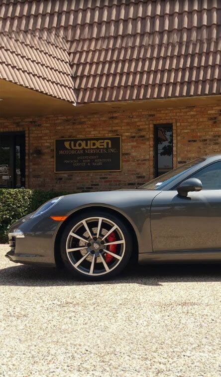 Porsche 911 Carrera Parked In Front Of Our Garage