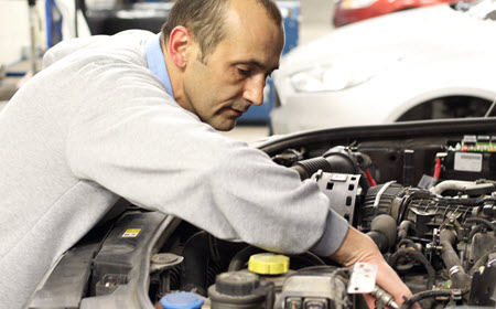 BMW Mechanic Checking Radiator Hose